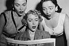 Women react in surprise at what they're reading ~ Women's Book Group at Forest Hill Presbyterian Church, Cleveland Heights, Ohio
